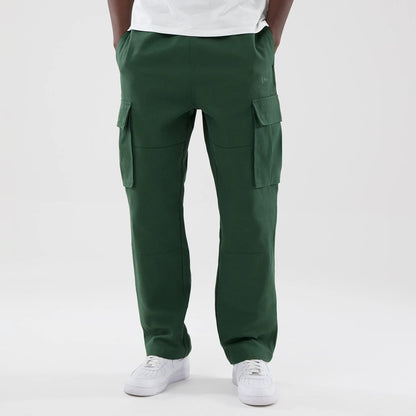 The model is wearing these New Era Cargo Trousers in dark green. 1