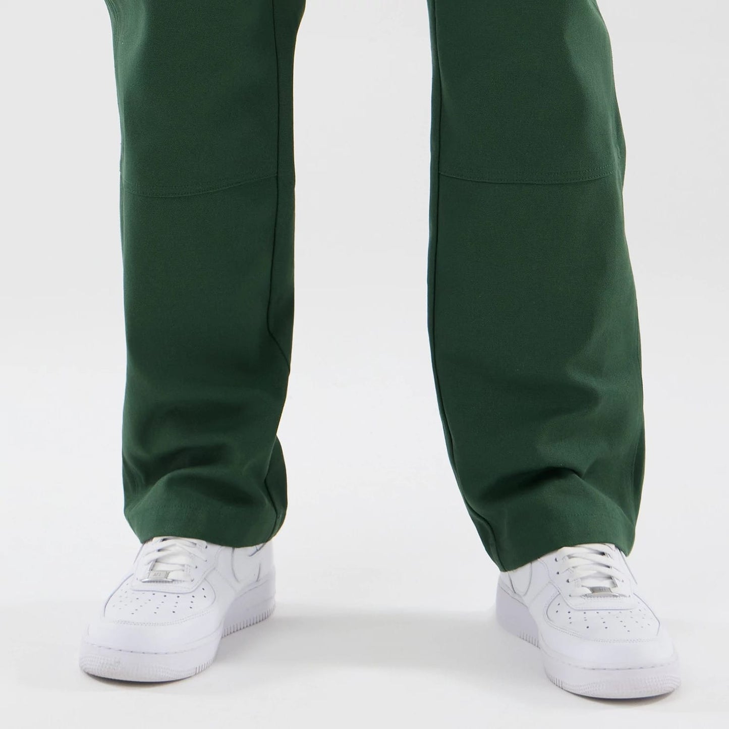 The model is wearing these New Era Cargo Trousers in dark green. 6