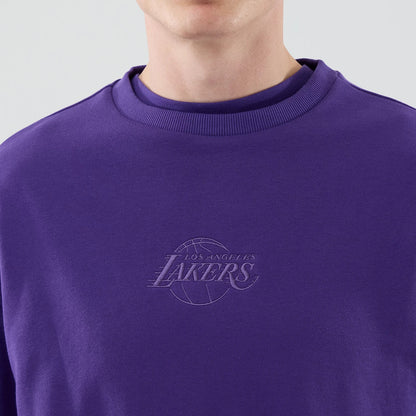 The model is wearing this NBA League Essential LA Lakers Oversized Crew Neck Sweater in purple. 4