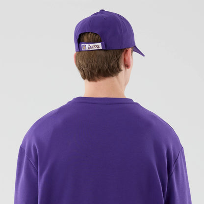 The model is wearing this NBA League Essential LA Lakers Oversized Crew Neck Sweater in purple. 7