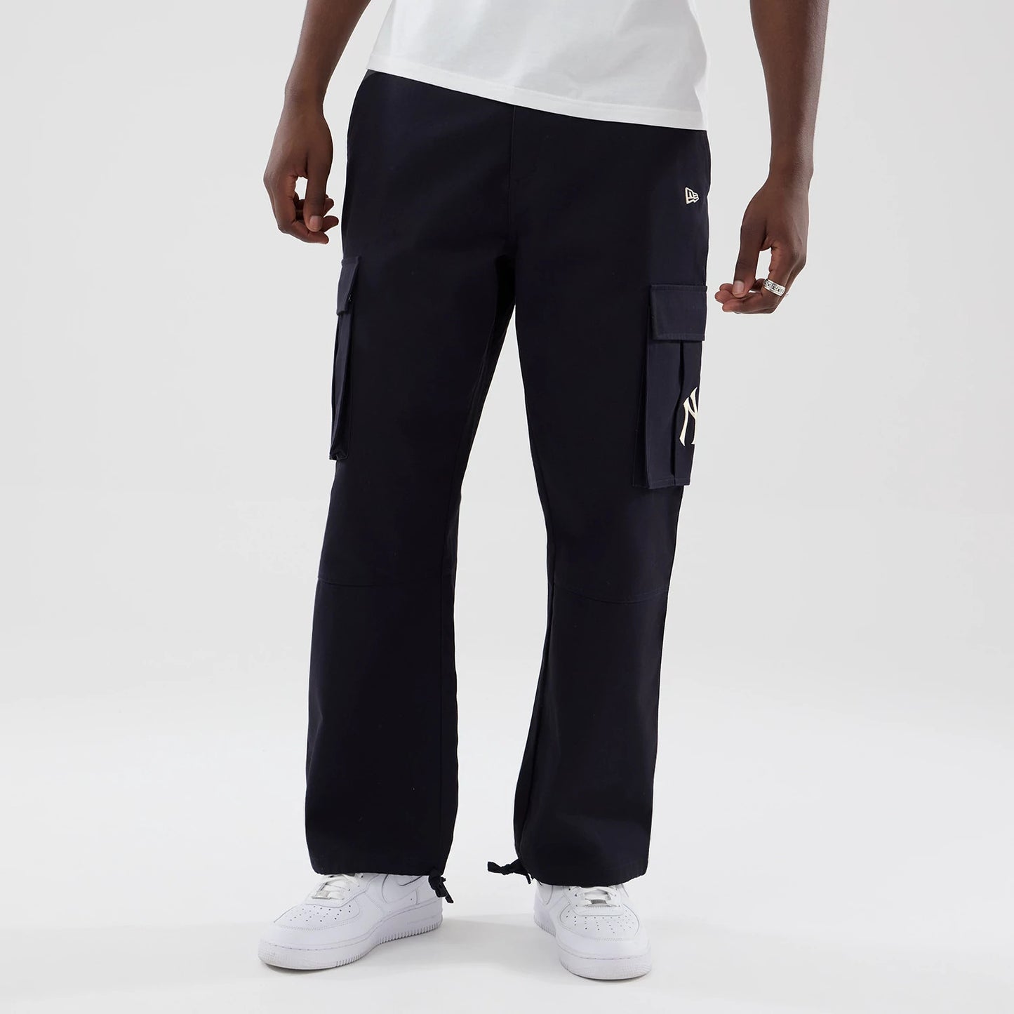 The model is wearing these MLB New York Yankees Cargo Trousers in navy. 3