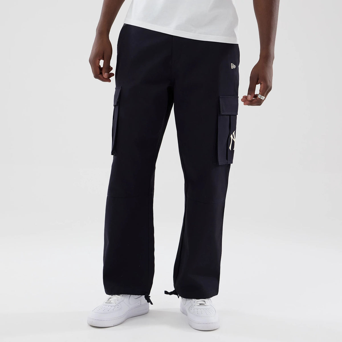 The model is wearing these MLB New York Yankees Cargo Trousers in navy. 3