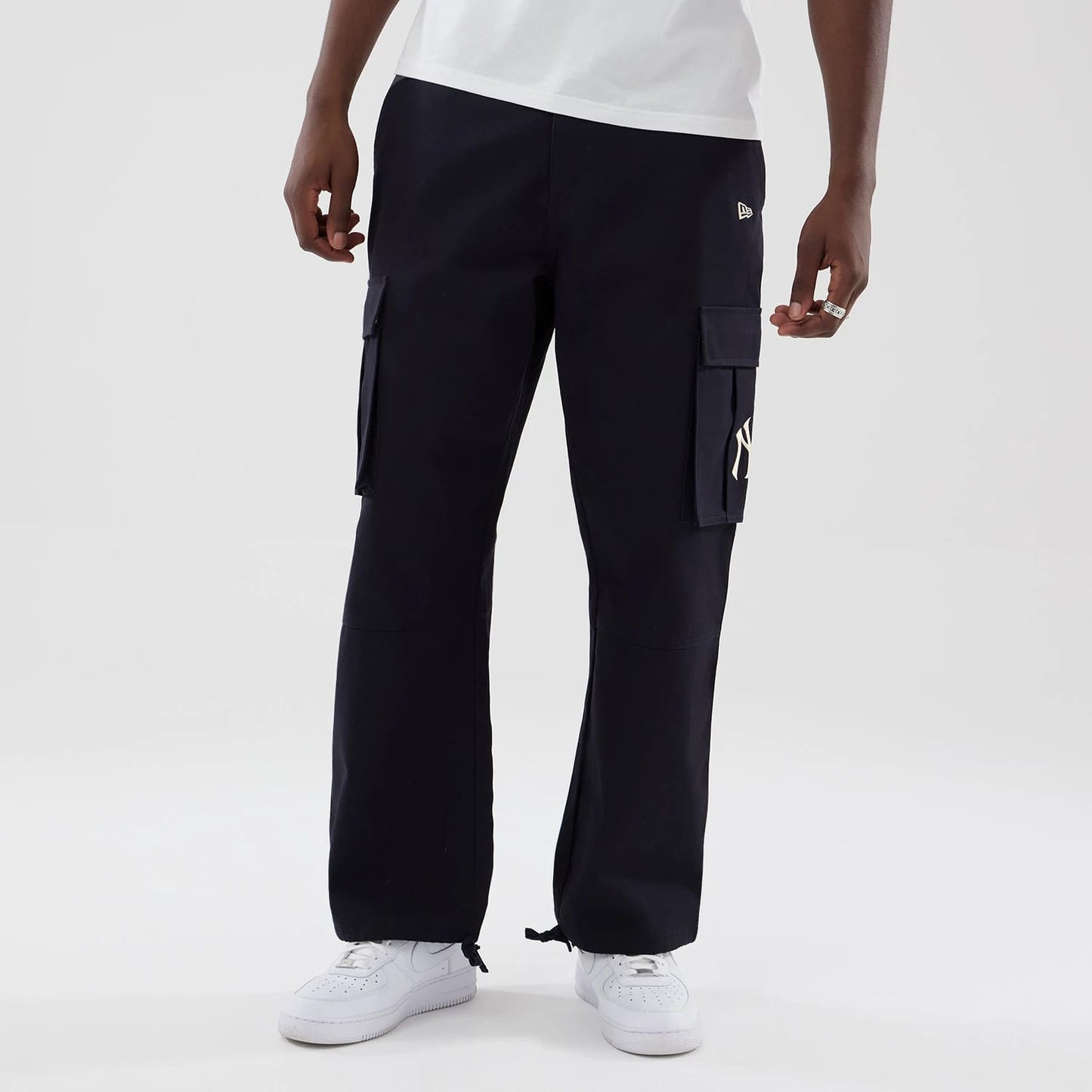 The model is wearing these MLB New York Yankees Cargo Trousers in navy. 3