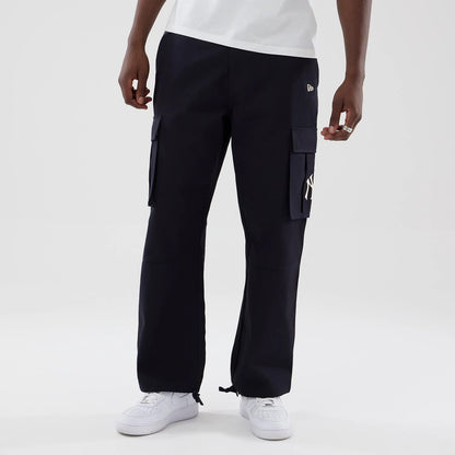 The model is wearing these MLB New York Yankees Cargo Trousers in navy. 3