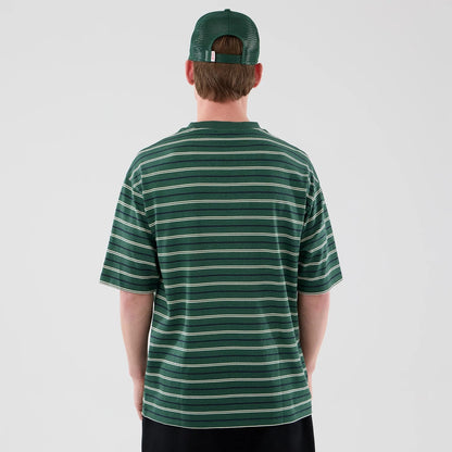 The model is wearing this New Era Stripe Oversized T-Shirt in dark green. 2