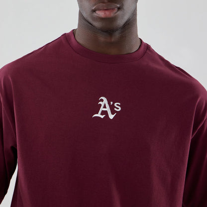 The model is wearing this MLB Midi League Essential Athletics Oversized T-Shirt in dark red. 5