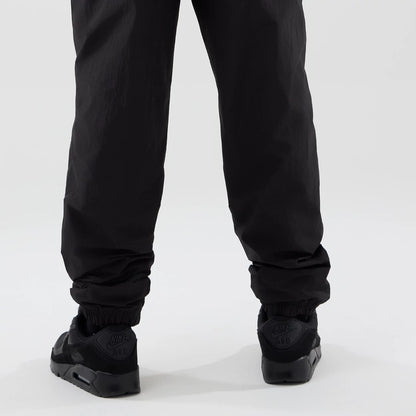The model is wearing these MLB Piping Track LA Dodgers Track Pants in black. 4