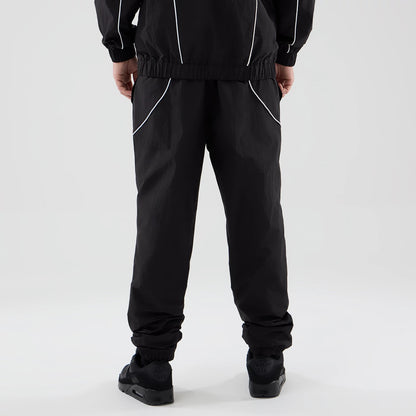 The model is wearing these MLB Piping Track LA Dodgers Track Pants in black. 2