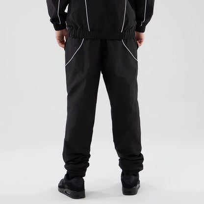 The model is wearing these MLB Piping Track LA Dodgers Track Pants in black. 2