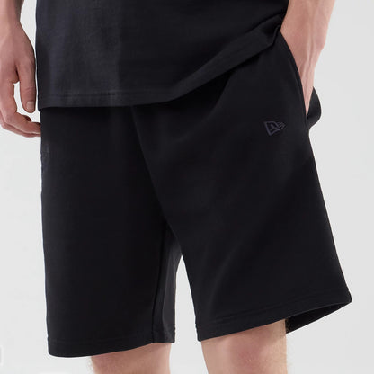 The model is wearing these NBA League Essential Chicago Bulls Oversized Shorts in black. 6