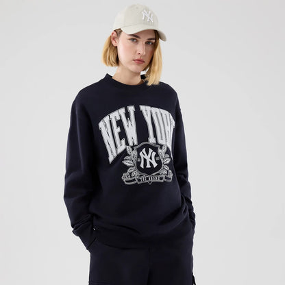 The model is wearing this MLB Arch Graphic New York Yankees Oversized Crew Neck Sweater in navy. 4