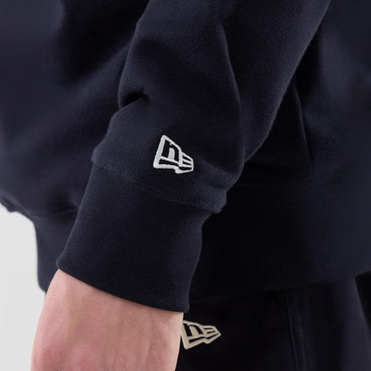 The model is wearing this MLB Arch Graphic New York Yankees Oversized Crew Neck Sweater in navy. 7
