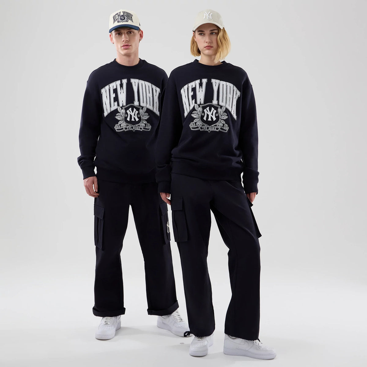 The model is wearing this MLB Arch Graphic New York Yankees Oversized Crew Neck Sweater in navy. 1