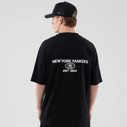 The model is wearing this MLB Logo Graphic New York Yankees Oversized T-Shirt in black. 2