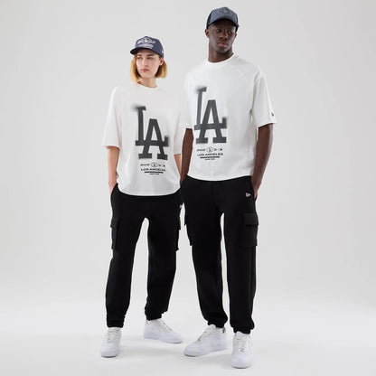The model is wearing this MLB Graphic LA Dodgers Boxy T-Shirt in white. 1