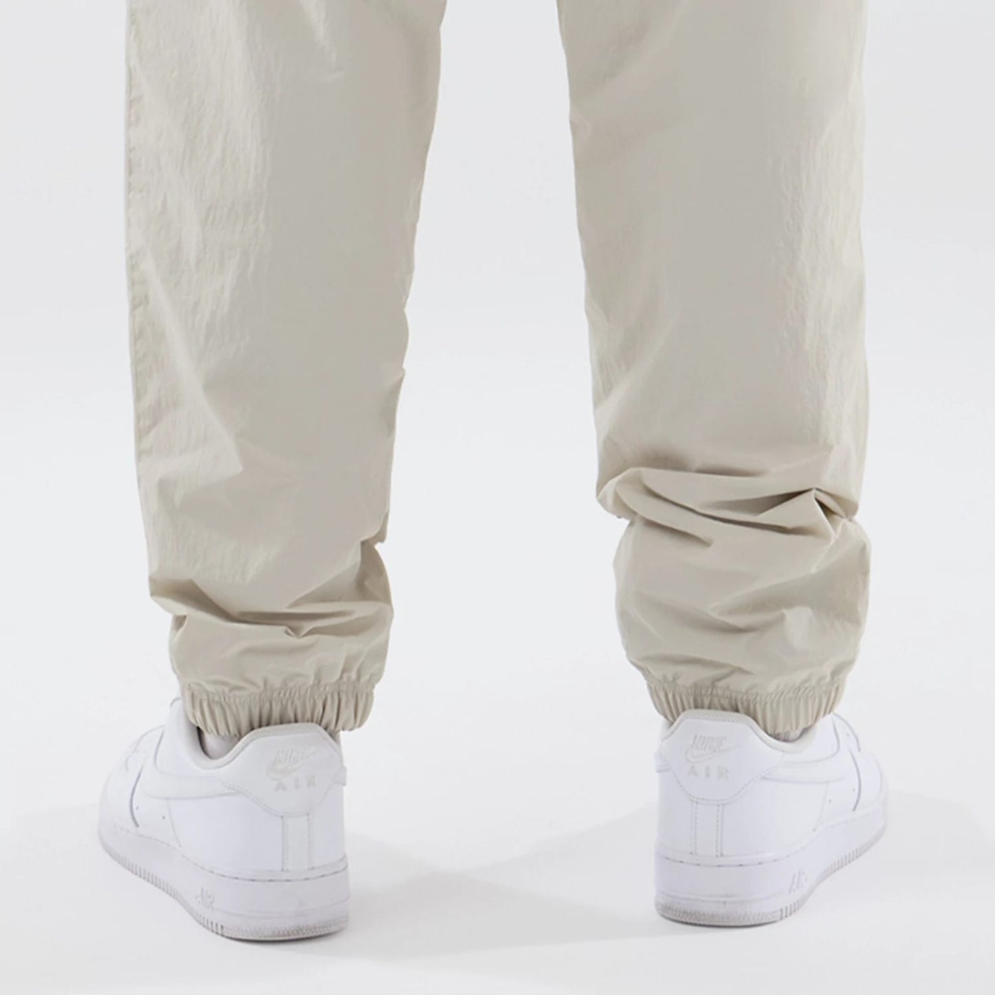 The model is wearing these MLB Piping Track New York Yankees Track Pants in cream. 7