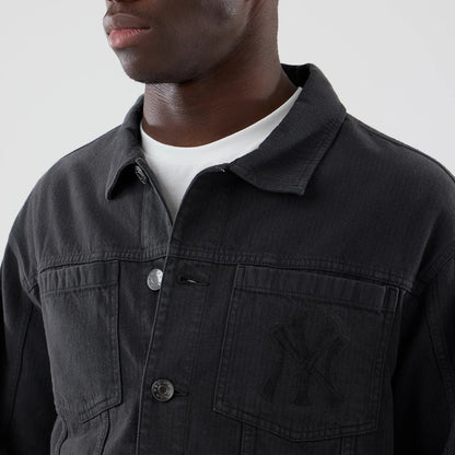 The model is wearing this MLB Stripe Denim New York Yankees Jacket in grey. 4