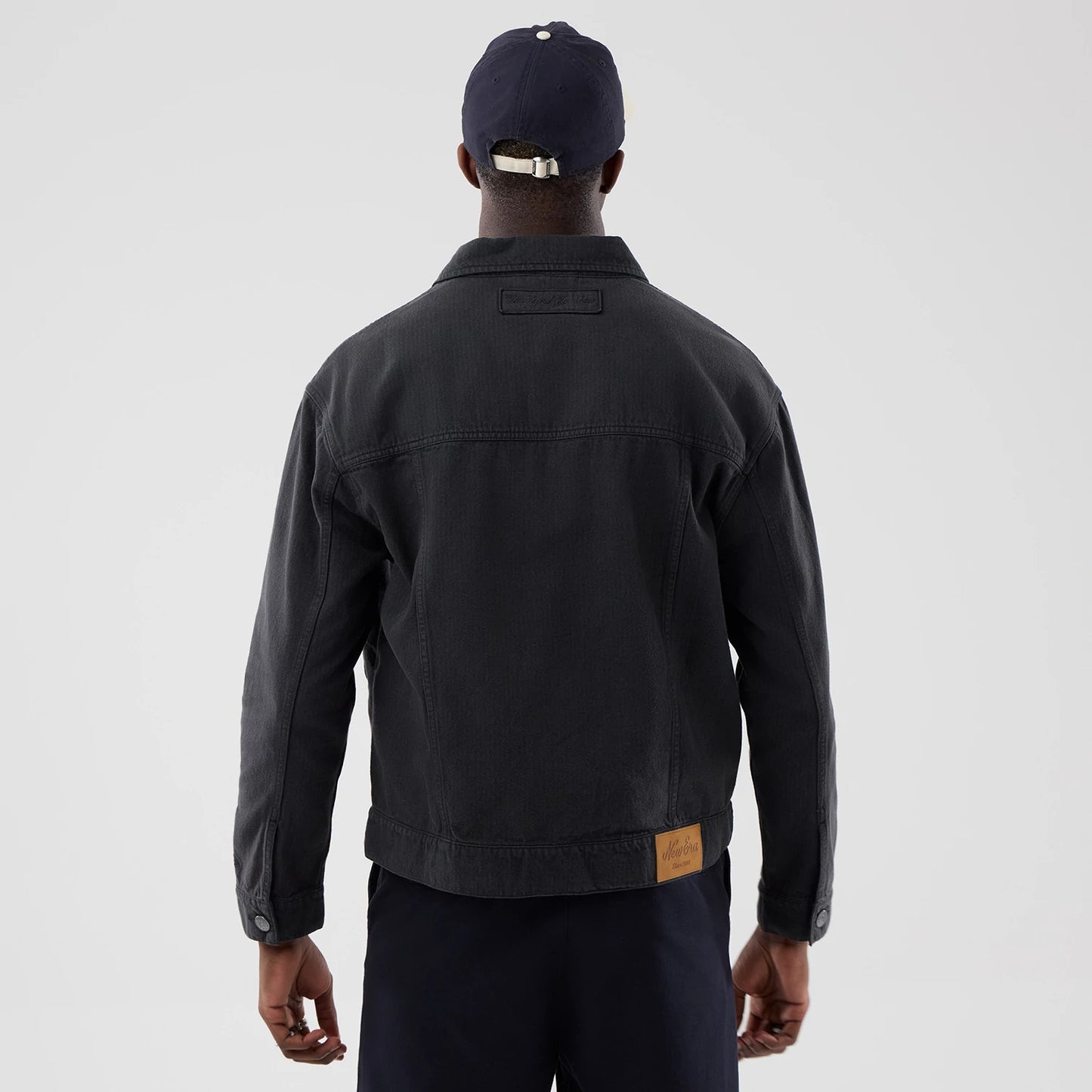 The model is wearing this MLB Stripe Denim New York Yankees Jacket in grey. 2