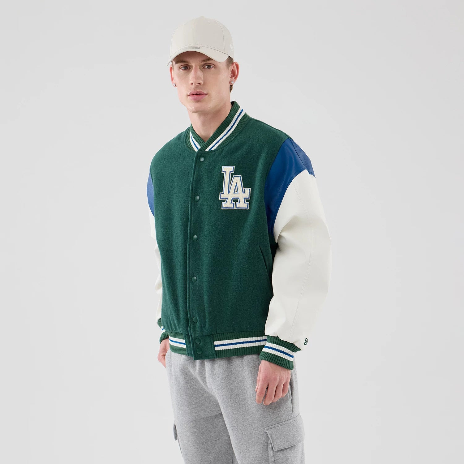 The model is wearing this MLB Varsity LA Dodgers Jacket in dark green. 3