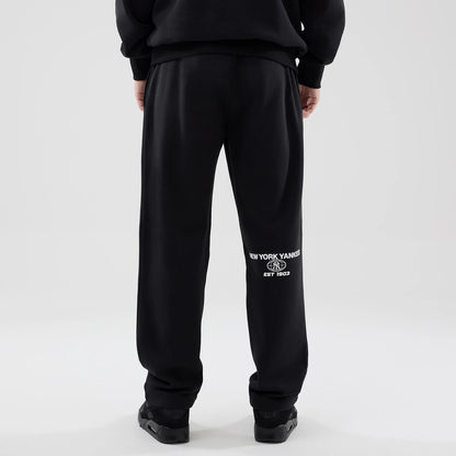 The model is wearing these MLB Logo Graphic New York Yankees Straight Leg Joggers in black. 2
