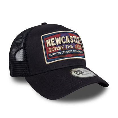 Newcastle United FC Navy New Era 9FORTY E-Frame Trucker Adjustable Cap, three-quarter view showing the raised embroidered Newcastle badge on the front panel, black mesh on the sides and back, and the 9FORTY size sticker on the curved visor.