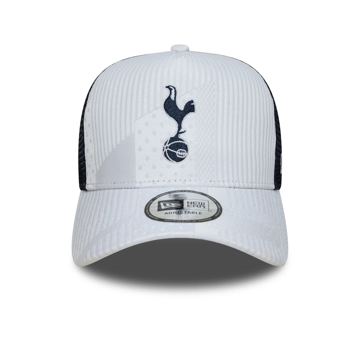 Tottenham Hotspur FC Pattern Knit White New Era 9FORTY E-Frame Trucker Adjustable Cap, front view showing the navy embroidered cockerel logo on the white front panel, black mesh side panels, and the grey 9FORTY size sticker on the pre-curved visor.