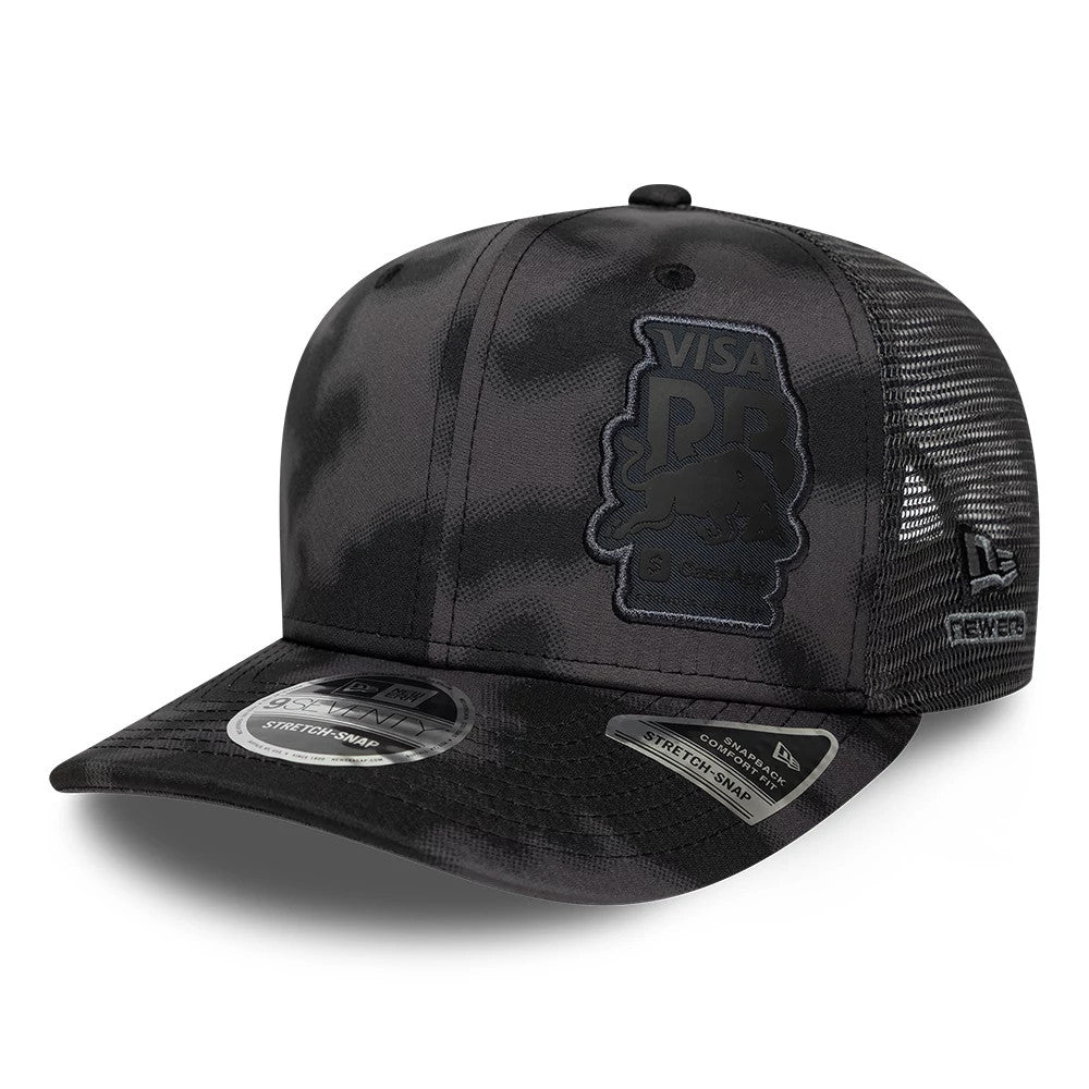 Visa Cash App Racing Bulls All Over Black New Era 9SEVENTY Stretch Snap Adjustable Cap, three-quarter view showing a black camo pattern with the Visa PBR logo in raised embroidery on the front panel, mesh back panels.