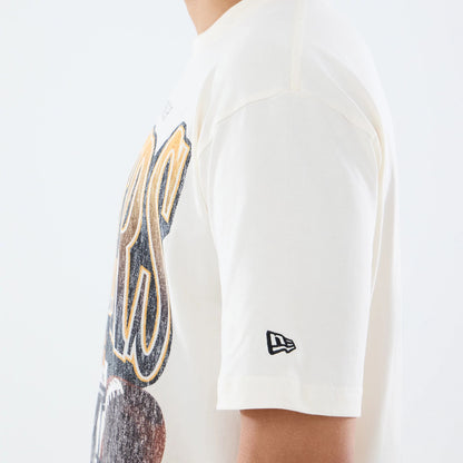 New Era Pittsburgh Steelers NFL Sport Classic Cream T-Shirt, side view showing large graphic lettering across the chest in black and yellow, with a black embroidered New Era logo positioned on the left sleeve's hem.