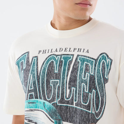 The model is wearing this NFL Sport Classic Philadelphia Eagles T-Shirt in cream. 4