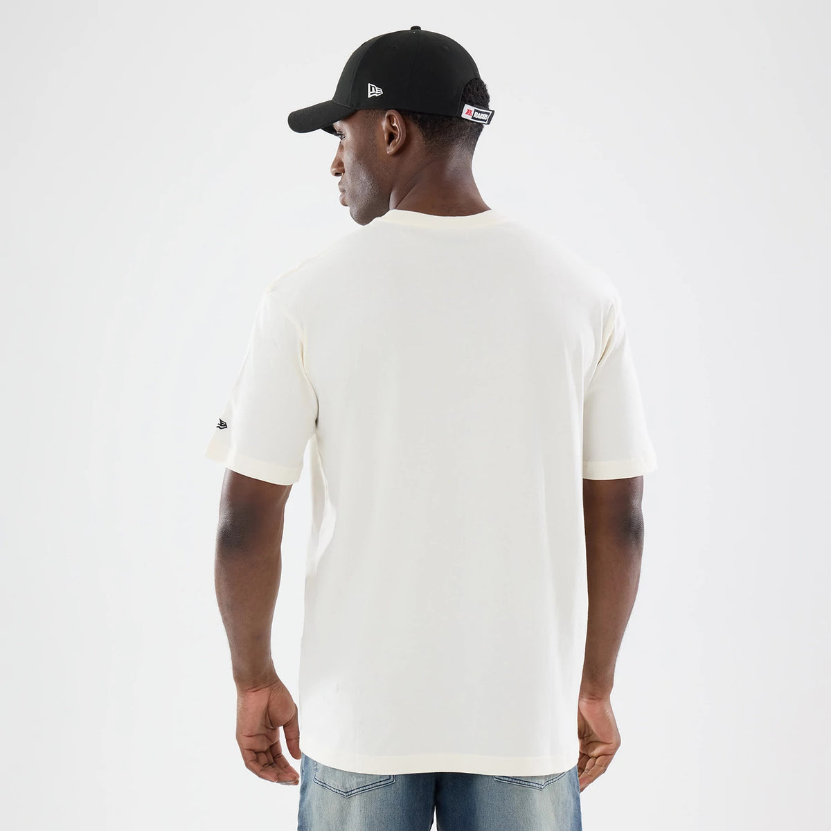 The model is wearing this NFL Sport Classic Las Vegas Raiders T-Shirt in cream. 2