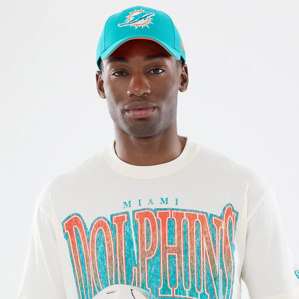 The model is wearing this NFL Sport Classic Miami Dolphins T-Shirt in cream. 6