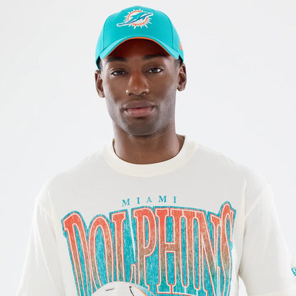 The model is wearing this NFL Sport Classic Miami Dolphins T-Shirt in cream. 6