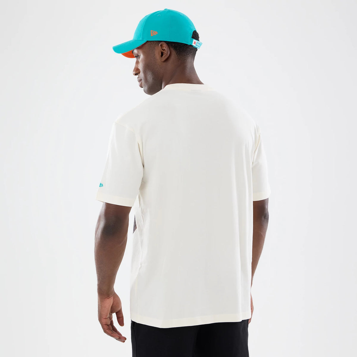 The model is wearing this NFL Sport Classic Miami Dolphins T-Shirt in cream. 2