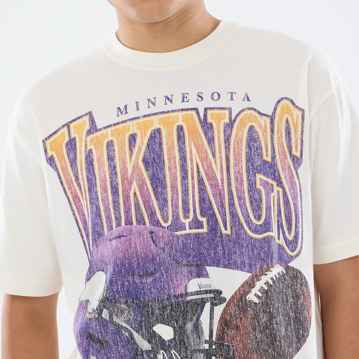 The model is wearing this NFL Sport Classic Minnesota Vikings T-Shirt in cream. 4