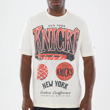 The model is wearing this NBA Sport Classic New York Knicks T-Shirt in cream. 3