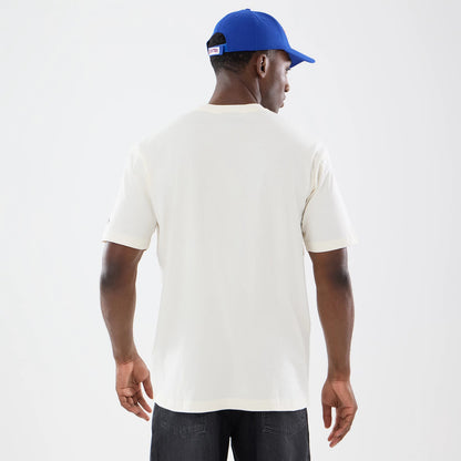The model is wearing this NBA Sport Classic New York Knicks T-Shirt in cream. 2
