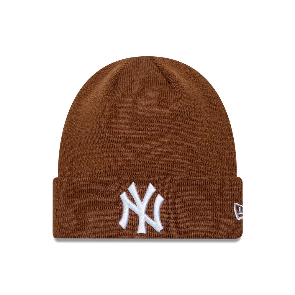 New Era New York Yankees MLB League Essential Brown Cuff Knit Beanie Hat, front view showing the raised white embroidered NY logo on the cuff, with a rich brown knit texture and the New Era flag logo embroidered in white on the side.