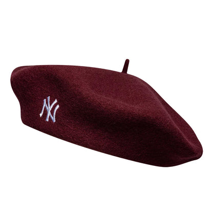 Pictured is this MLB Wool Script New York Yankees Beret in dark red. 1