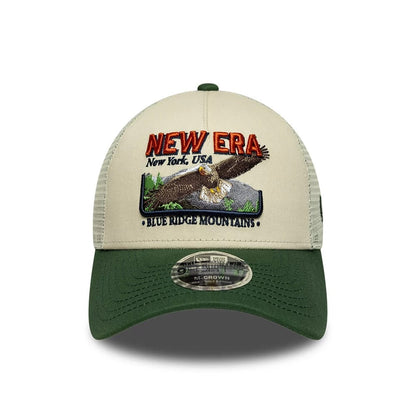 Pictured is this New Era Graphic 9FORTY M-Crown A-Frame Trucker cap in cream. 2