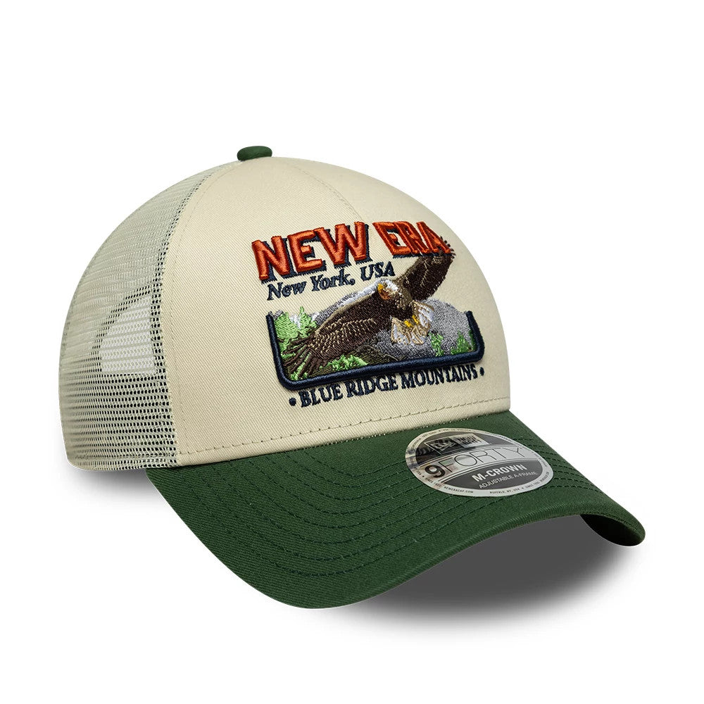 Pictured is this New Era Graphic 9FORTY M-Crown A-Frame Trucker cap in cream & green. 3