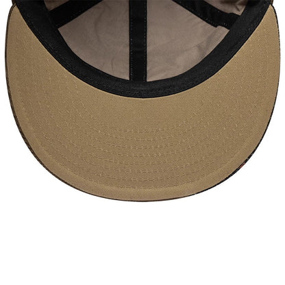 Yankees MLB Patchwork Dark Brown Retro Crown New Era 9FIFTY Adjustable Cap, inside view showing a tan undervisor, black sweatband, and black internal taping providing a glimpse of the cap's structural details and construction.