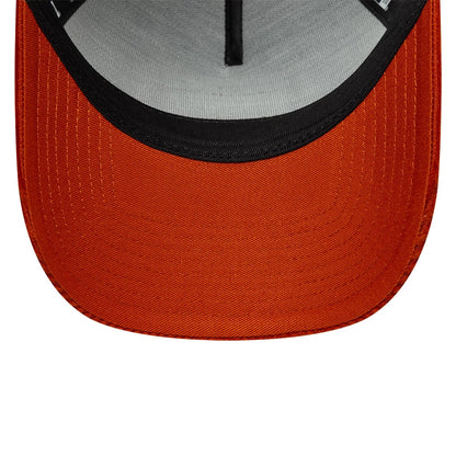 New Era Patch Cord Navy & Red New Era 9FORTY A-Frame Trucker Adjustable Cap, inside view showing the grey sweatband, contrasting red undervisor with stitching details, and interior black taping, offering a detailed look at the cap's construction.