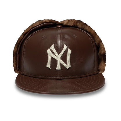Pictured is this MLB Leather New York Yankees Dogear 59FIFTY Fitted cap in brown. 4