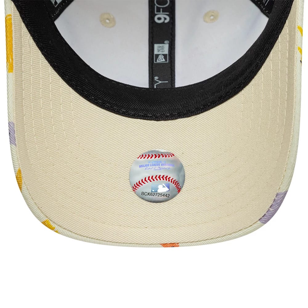 Pictured is this Toddler New Era All Over Dino 9FORTY cap in cream. 5
