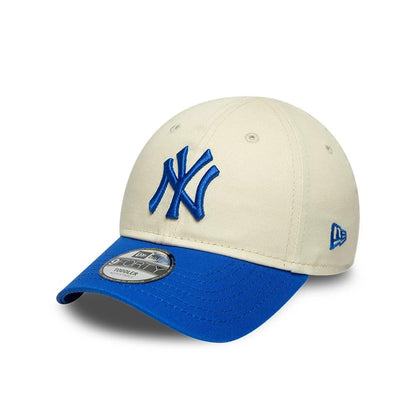 Pictured is this Toddler MLB League Essential New York Yankees 9FORTY cap in cream & blue. 1