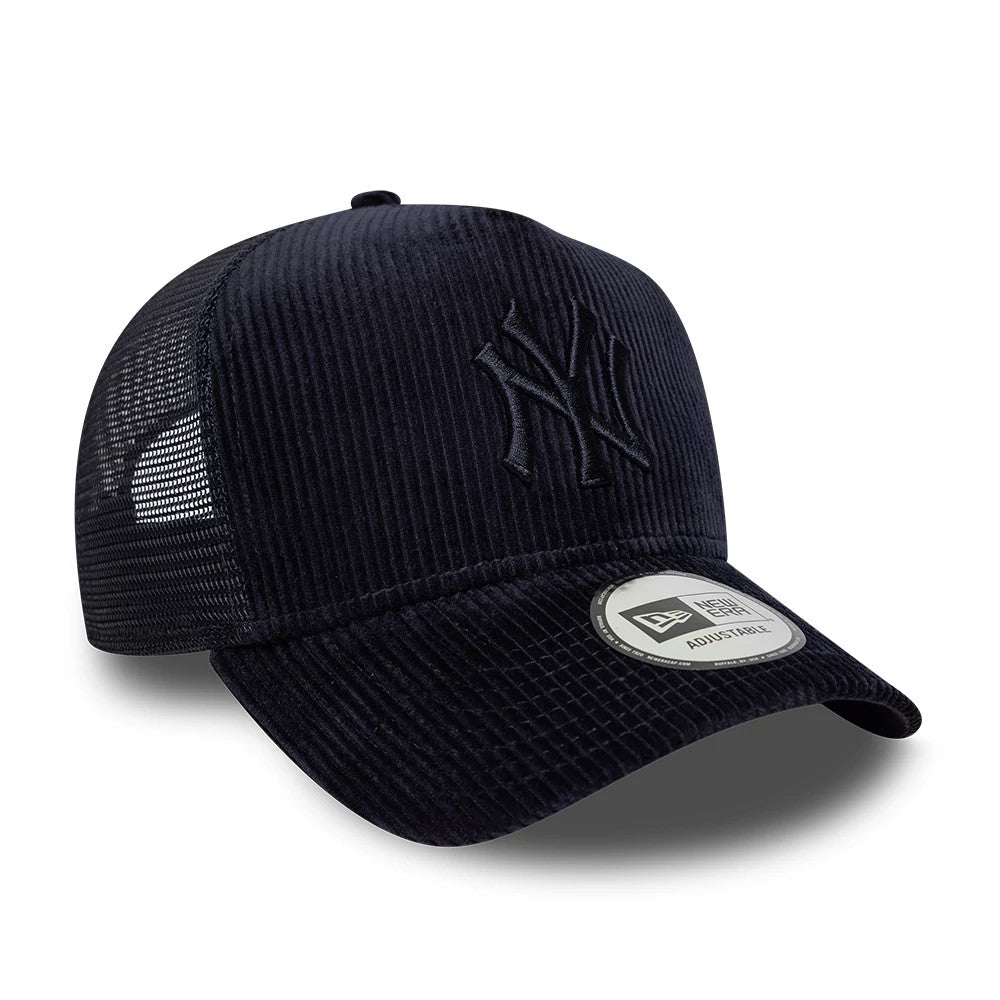 New York Yankees MLB Cord Navy New Era 9FORTY A-Frame Trucker Adjustable Cap, three-quarter view showing the raised embroidered navy Yankees logo on the front panel, with a curved visor and a 9FORTY size sticker, and mesh back panels.