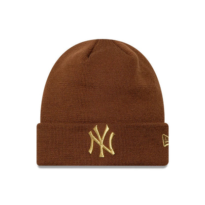 Pictured is this Womens MLB Metallic Logo New York Yankees Cuff Knit Beanie hat in brown. 1