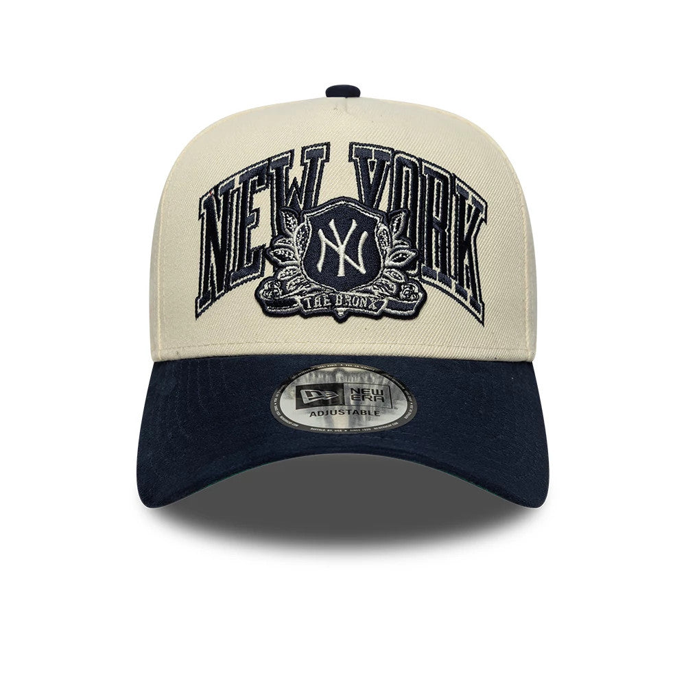 New York Yankees MLB Suede Cream & Navy New Era 9FORTY E-Frame Adjustable Cap, front view showing raised navy New York lettering and NY emblem embroidery on the cream front panel, with a contrasting navy curved visor featuring a 9FORTY size sticker.