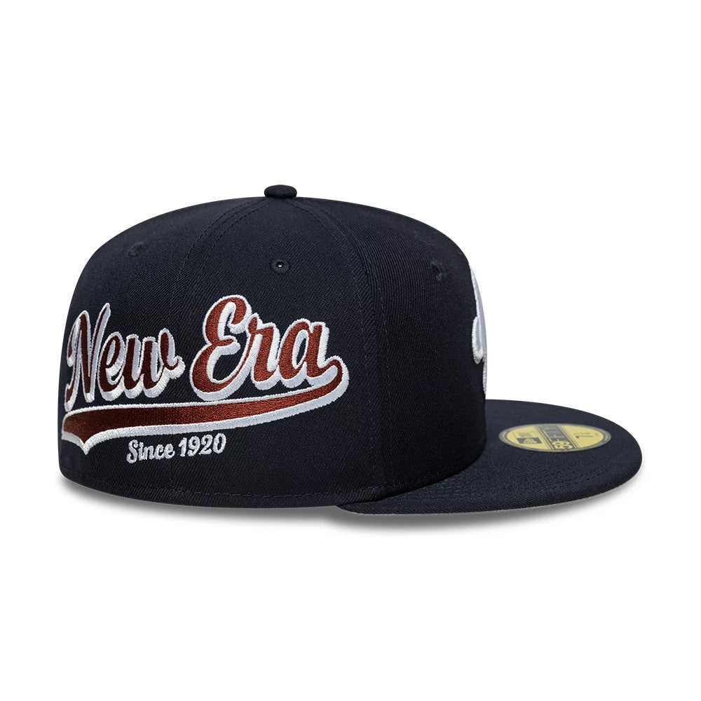 Pictured is this New Era Heritage Script 59FIFTY Fitted cap in navy. 7