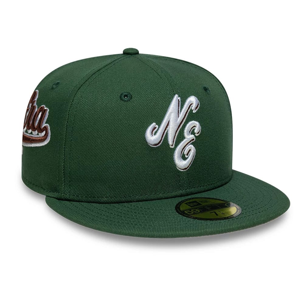 Pictured is this New Era Heritage Script 59FIFTY Fitted cap in dark green. 1